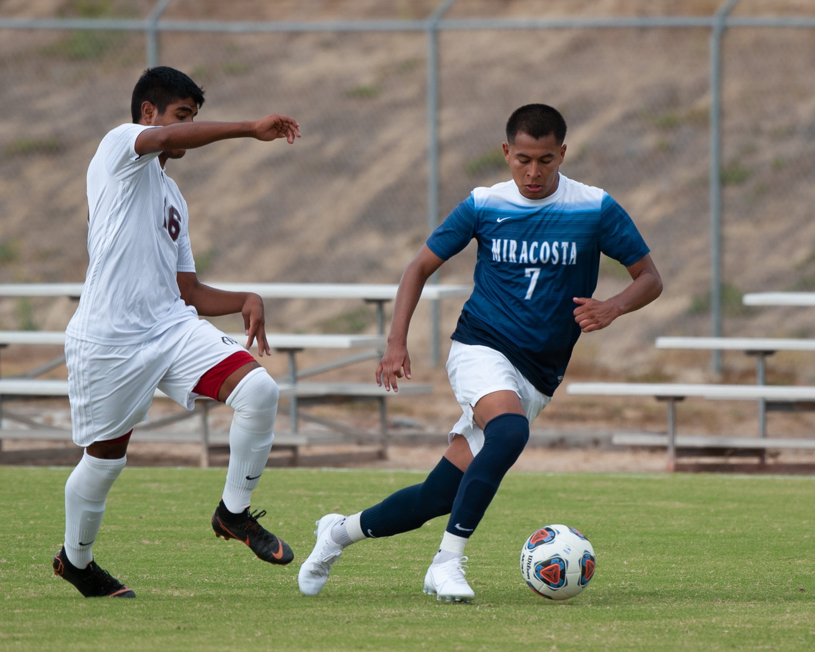 Heron Martinez dribbling the soccer ball in a game.
