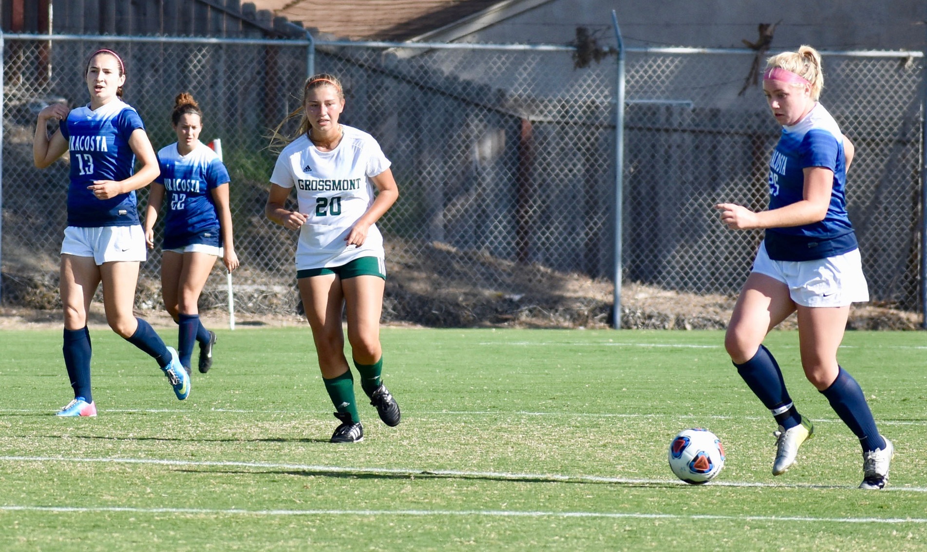 Jenna Heatherly dribbles a soccer ball in a game.