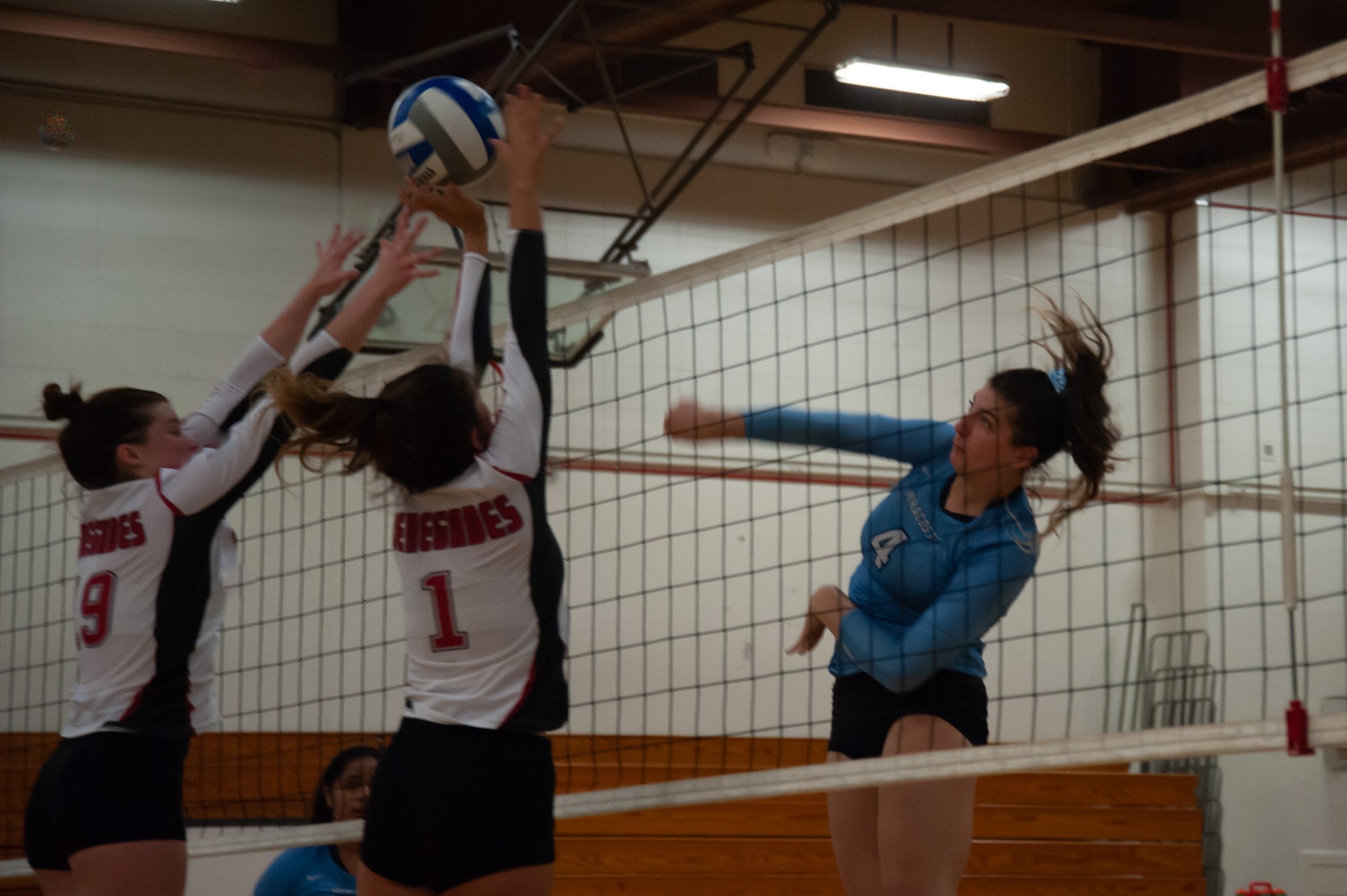 Leigha Malecah hits a ball over the net.