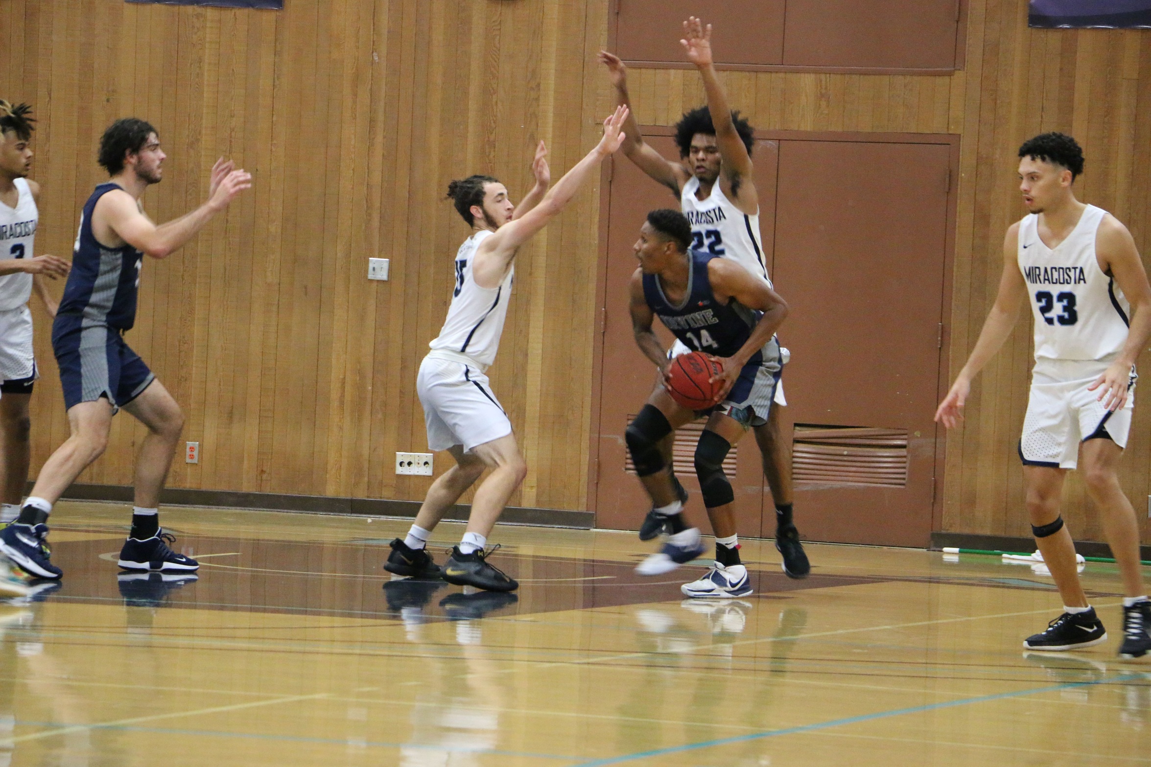 MiraCosta men's basketball players play defense during a recent game.