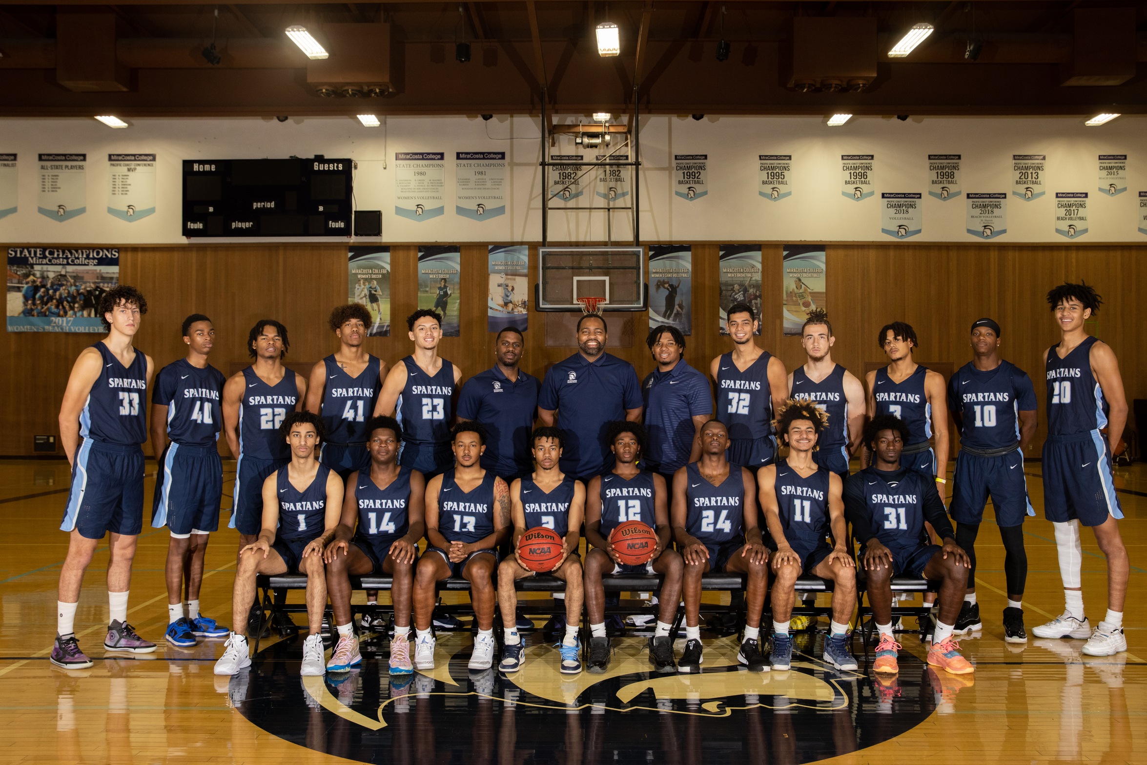 Men's Basketball team picture with coaches.