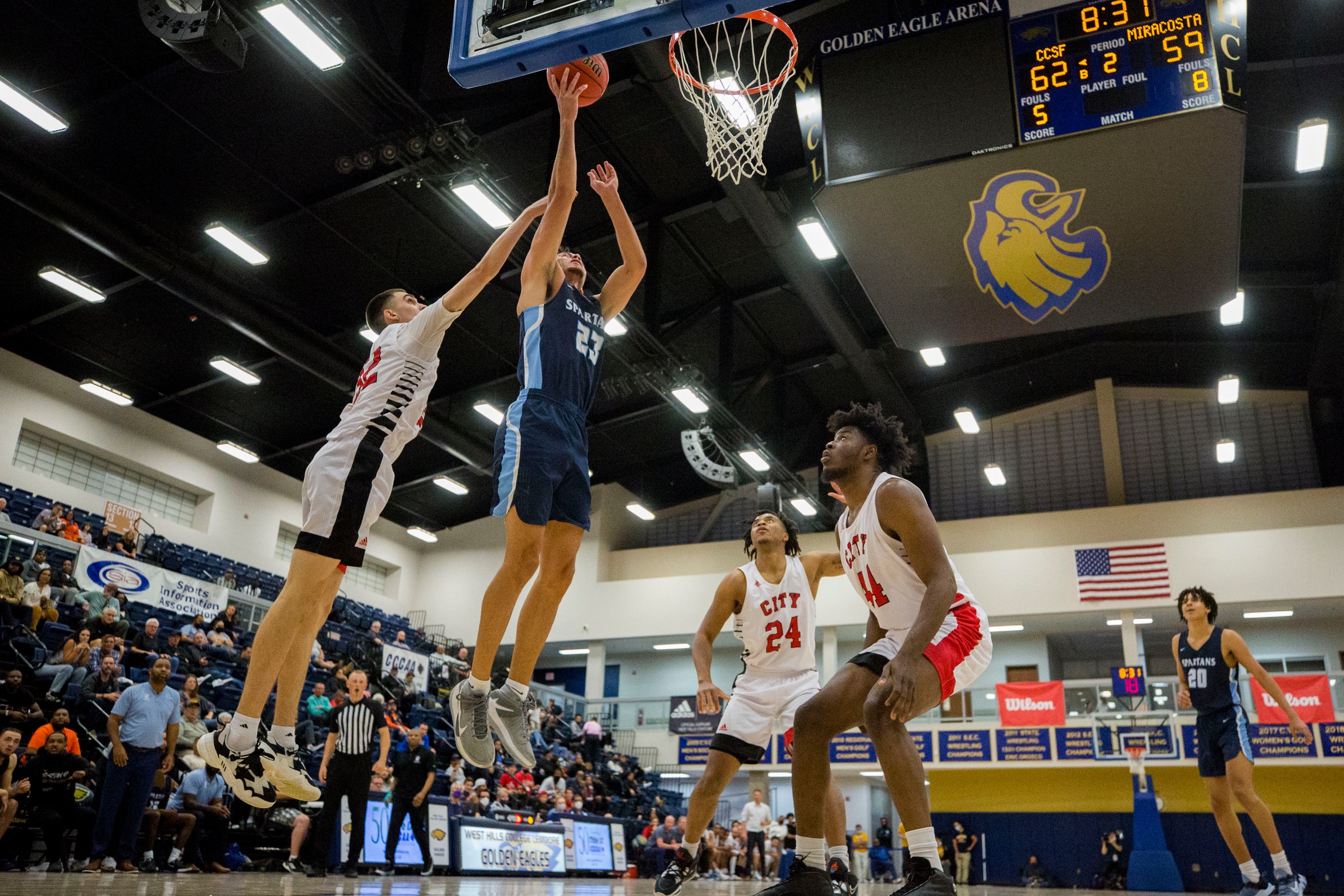 MiraCosta player rebounds the basketball during the Elite 8 game at West Hills College.