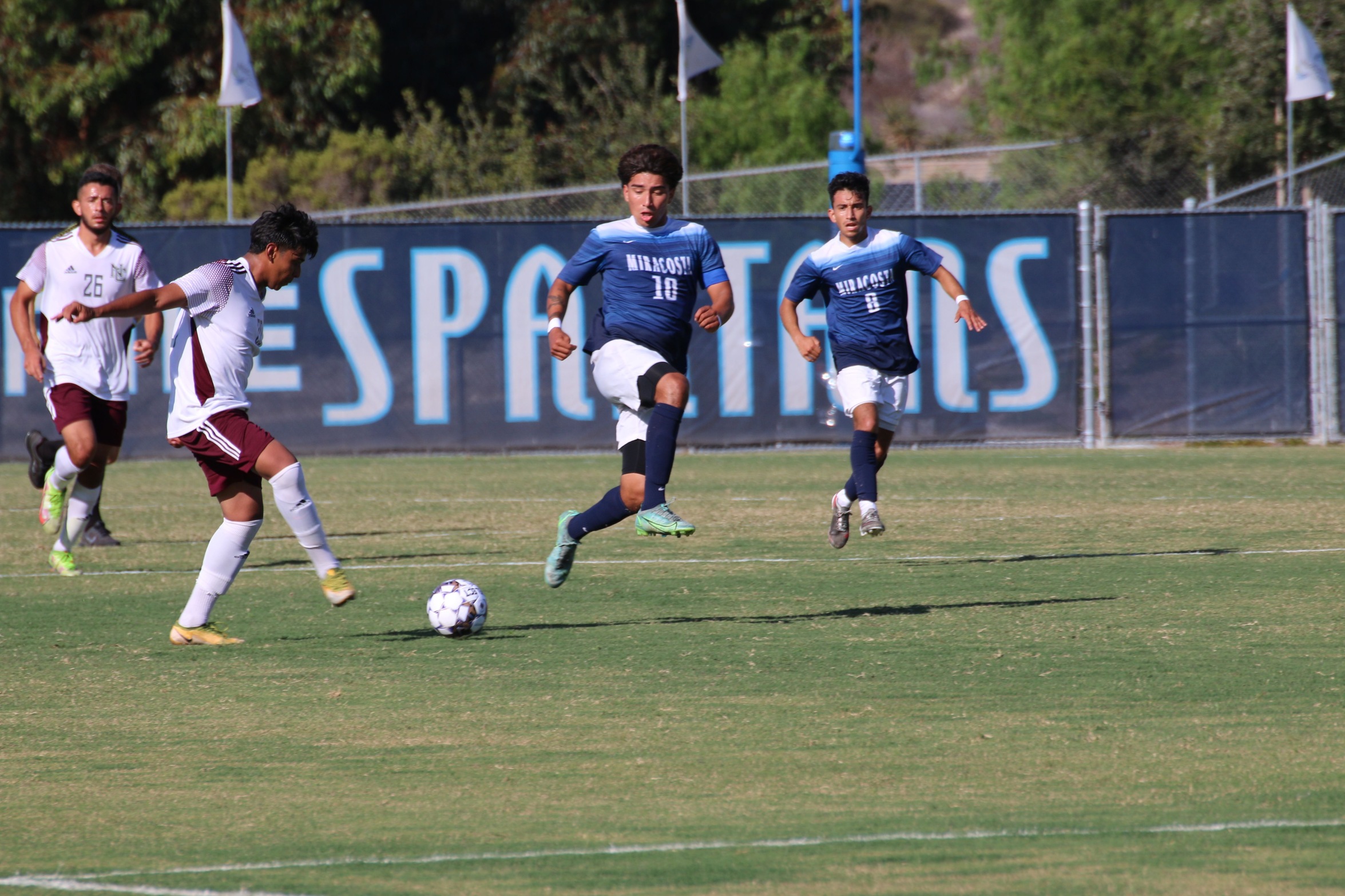 George Silva and Bryan Sahagun try to get the ball.