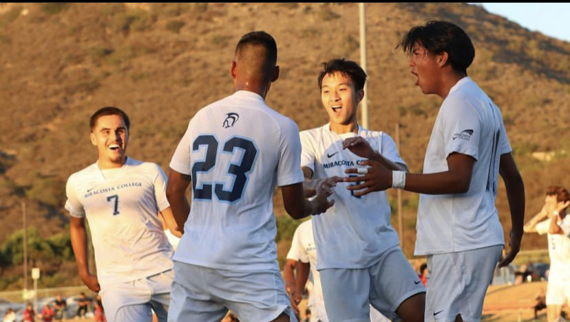 Spartan players celebrate after scoring a goal against rival Palomar College.